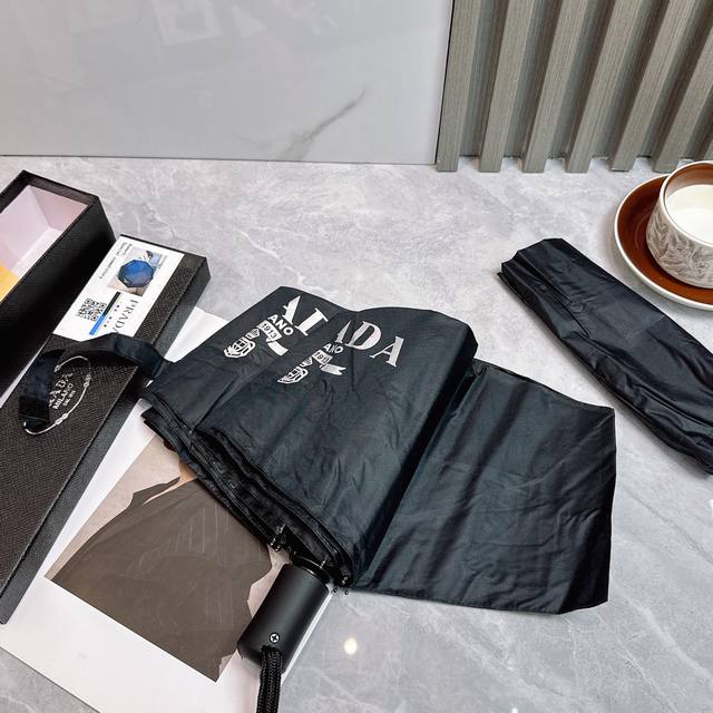 p60 普拉达（Prada）夏季新款 全自动折叠晴雨伞 黑色涂层防晒有效阻隔紫外线99%，Upf>50 所以能起到伞下体感降温的效果！ 有效隔热，高效防晒 一把
